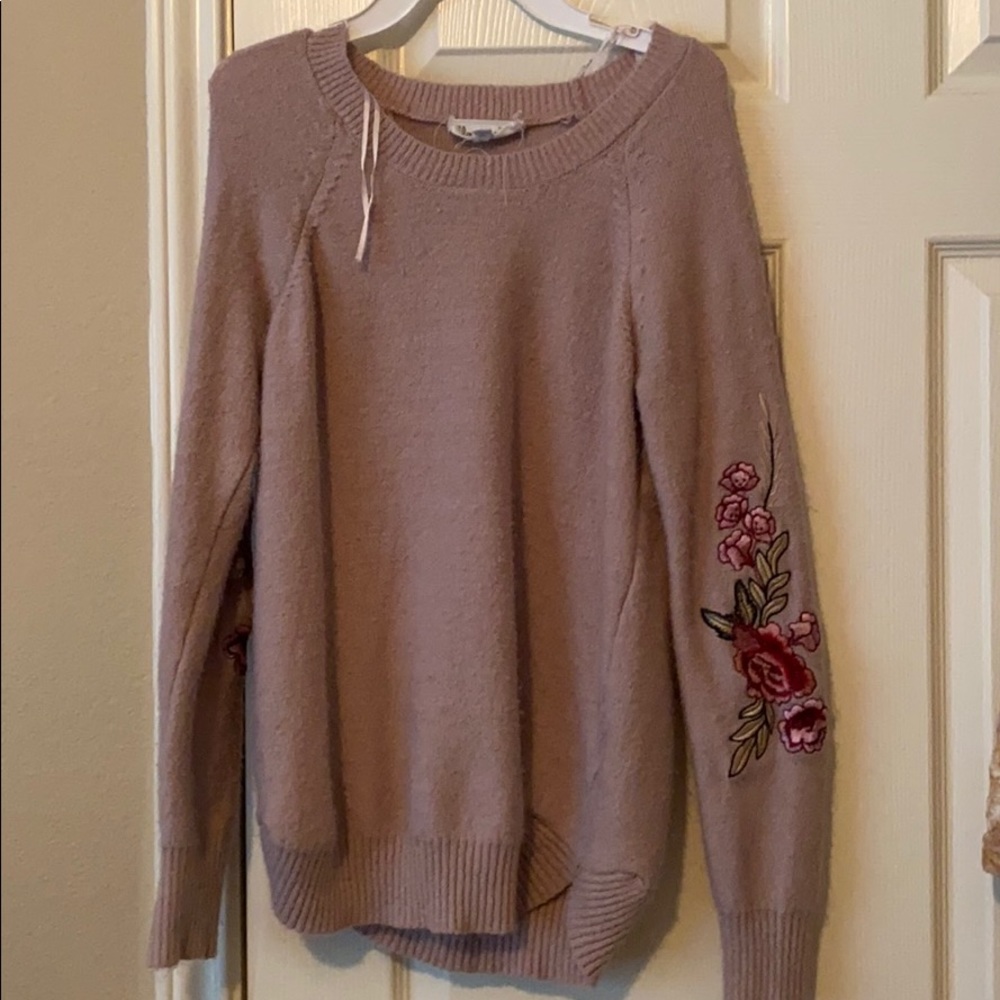 Dark pink sweater.